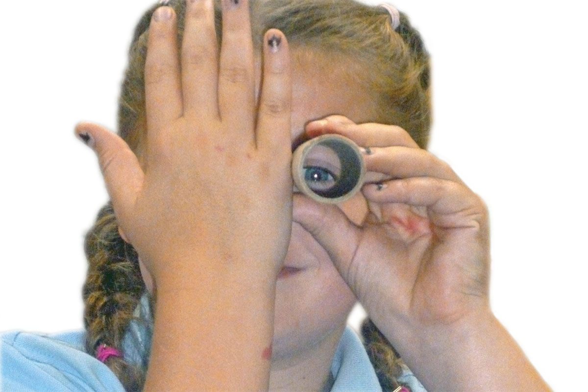 Nov-ArtsAward-girl looking through tube Photo: FREE Support for Arts Award