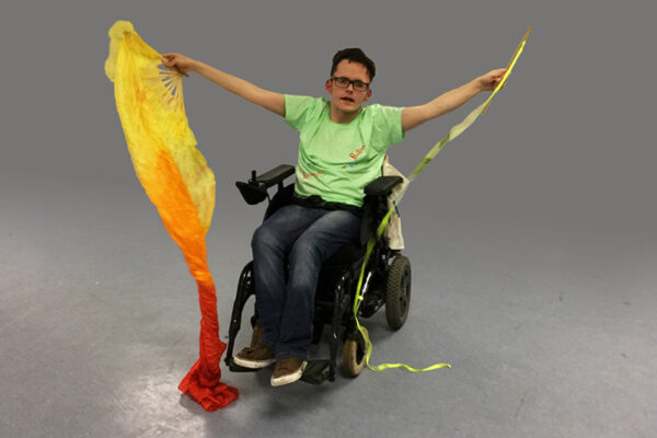 photo of Scott, a DIY Young Leader, demonstrating his Circus Skills