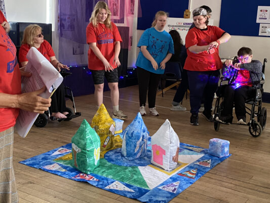 DIY members explore playing a game with the close knit textile sculptures
